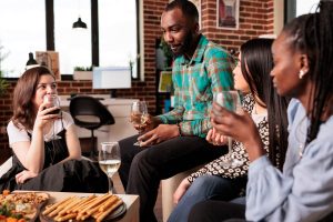 Different ethnicities women listening man conversation