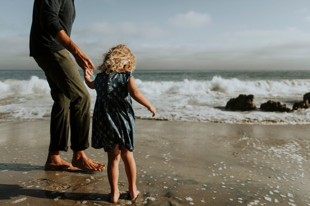 Father and daughter at a beach